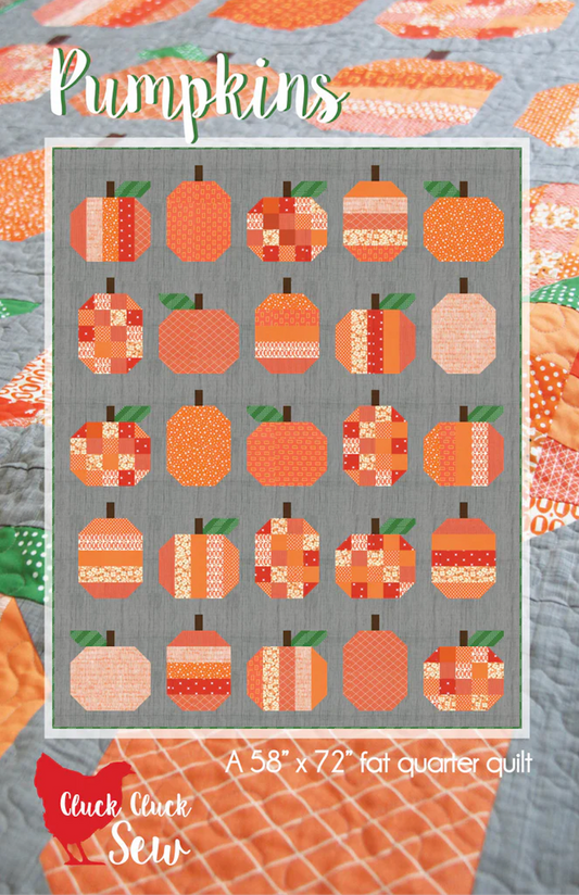 A quilt pattern cover titled "Pumpkins" showing a grid of pumpkin patch designs in orange, peach, cream, and red tones on a gray background, with the text "A 58 x 72 fat quarter quilt" and the brand "Cluck Cluck Sew" visible.
Photo by Cluck Cluck Sew [image_link]
