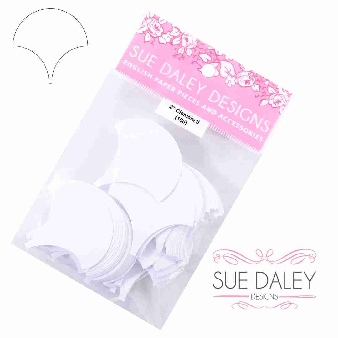A package of white paper craft pieces labeled 'Sue Daley Designs English Paper Pieces and Accessories' on a white background, with a small line drawing of the shape shown in the upper left.
Photo by Sue Daley [additional_image_link]