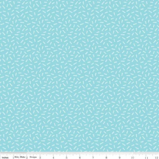 A fat quarter bundle of quilt fabric featuring a geometric pattern in various shades of blue.
Photo by RileyBlakeDesigns.com [image_link]