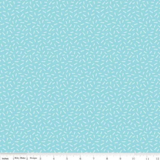 A fat quarter bundle of quilt fabric featuring a geometric pattern in various shades of blue.
Photo by RileyBlakeDesigns.com [image_link]