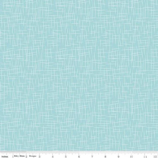 A fat quarter bundle of quilt fabric featuring a geometric pattern in various shades of blue.
Photo by RileyBlakeDesigns.com [additional_image_link]