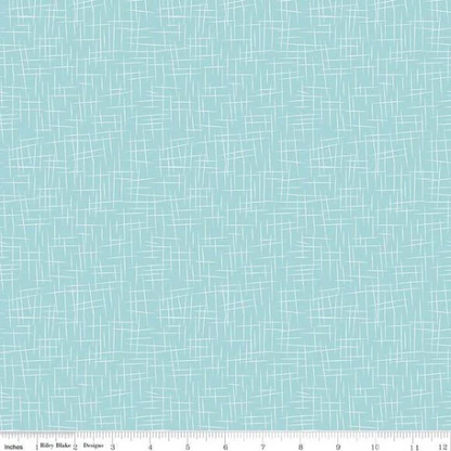 A fat quarter bundle of quilt fabric featuring a geometric pattern in various shades of blue.
Photo by RileyBlakeDesigns.com [additional_image_link]