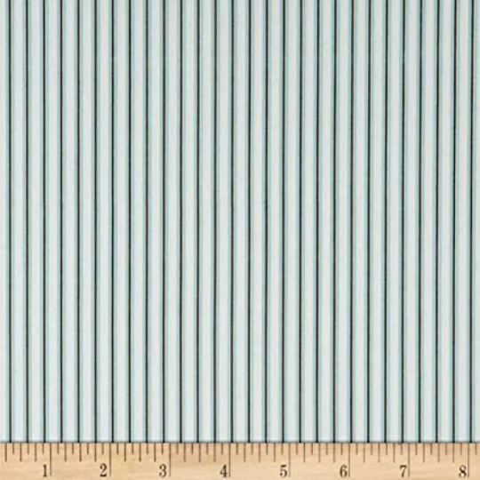 A fat quarter bundle of quilt fabric featuring a geometric pattern in various shades of blue.
Photo by RileyBlakeDesigns.com [additional_image_link]