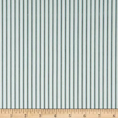 A fat quarter bundle of quilt fabric featuring a geometric pattern in various shades of blue.
Photo by RileyBlakeDesigns.com [additional_image_link]