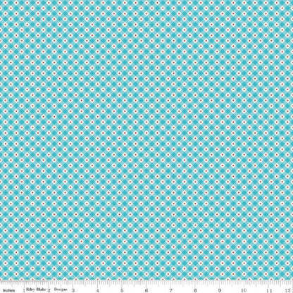 A fat quarter bundle of quilt fabric featuring a geometric pattern in various shades of blue.
Photo by RileyBlakeDesigns.com [additional_image_link]
