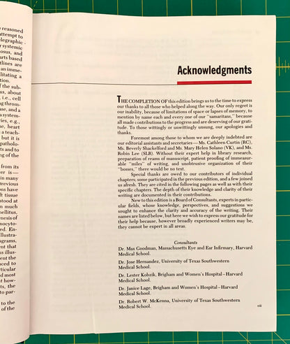 An open book spread showing printed text and a red 'Acknowledgments' heading, photographed against a green grid background.
[additional_image_link]