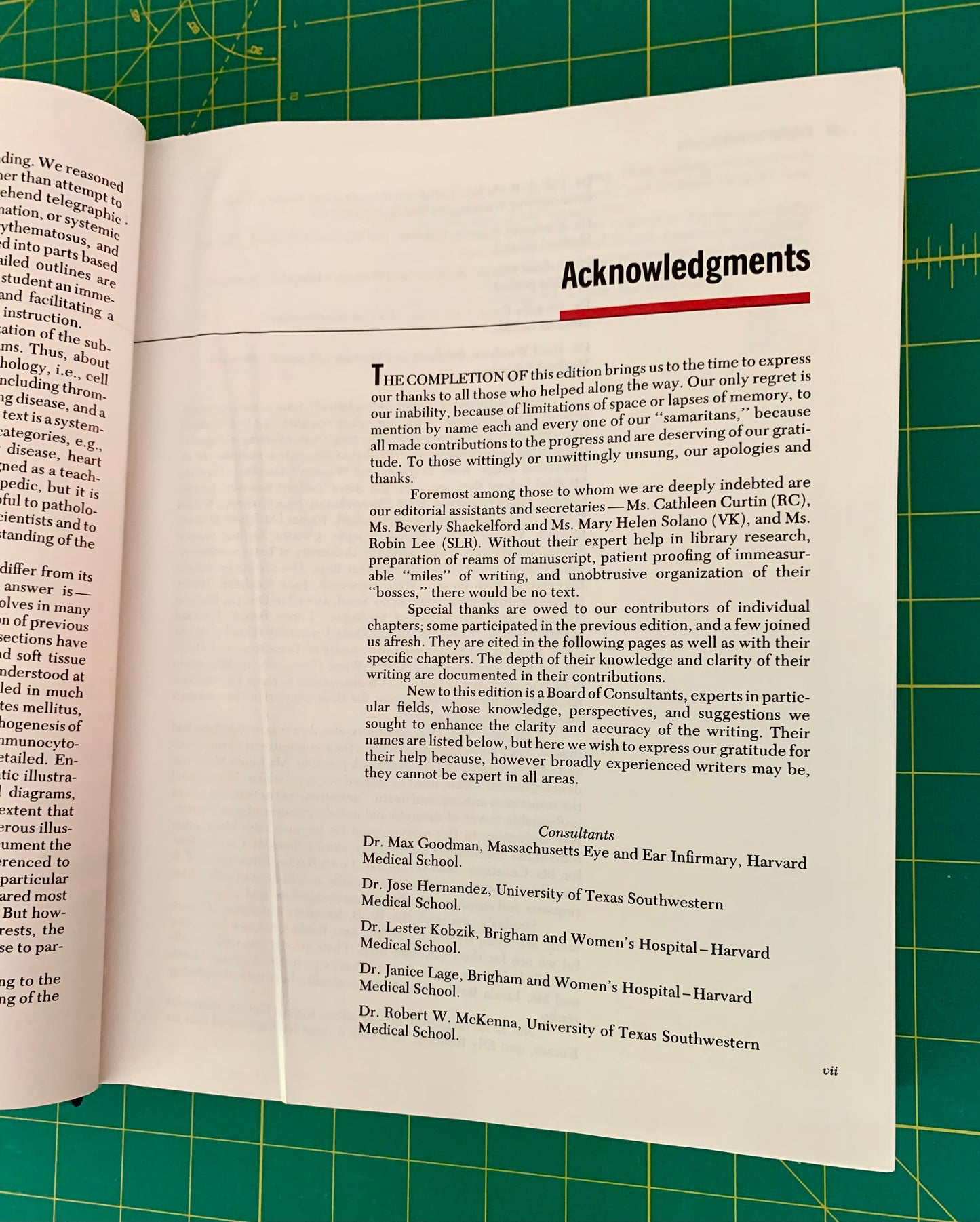 An open book showing the 'Acknowledgments' page, photographed from above on a green cutting mat with grid lines.
[additional_image_link]