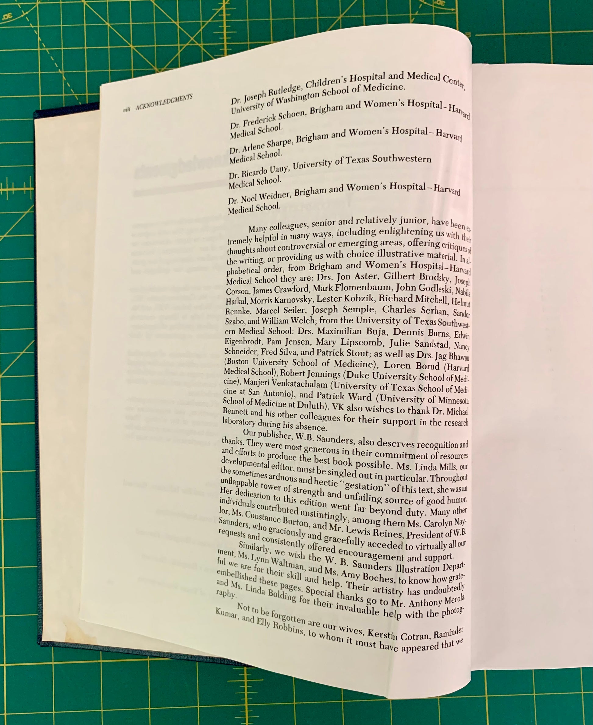 A printed page from a book or magazine laid flat on a green cutting mat, showing black text on an off-white page.
[additional_image_link]