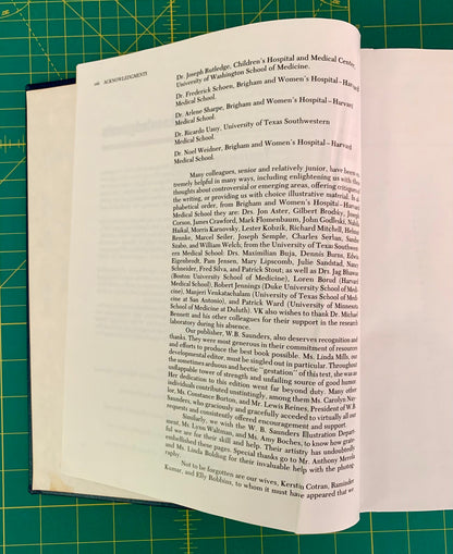 A printed page from a book or magazine laid flat on a green cutting mat, showing black text on an off-white page.
[additional_image_link]