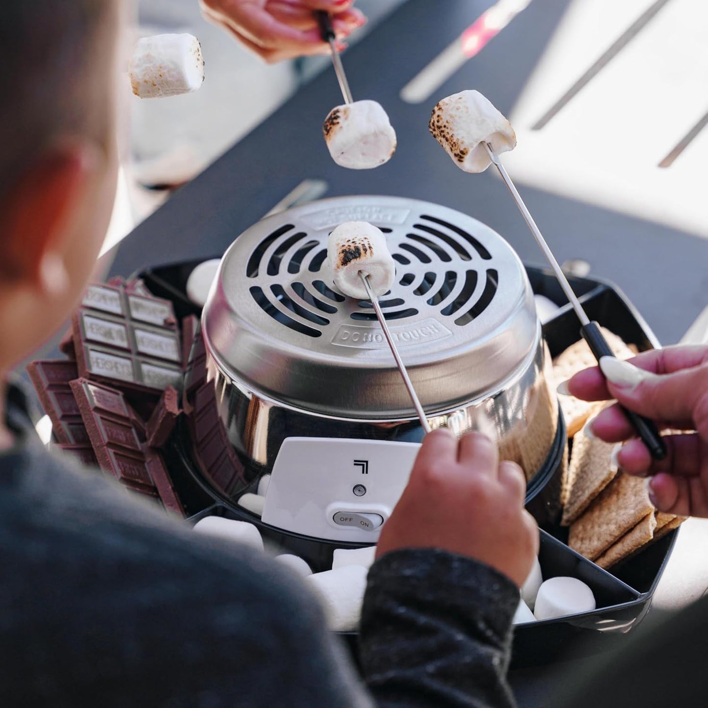photo of family using the smores maker
[additional_image_link] 
