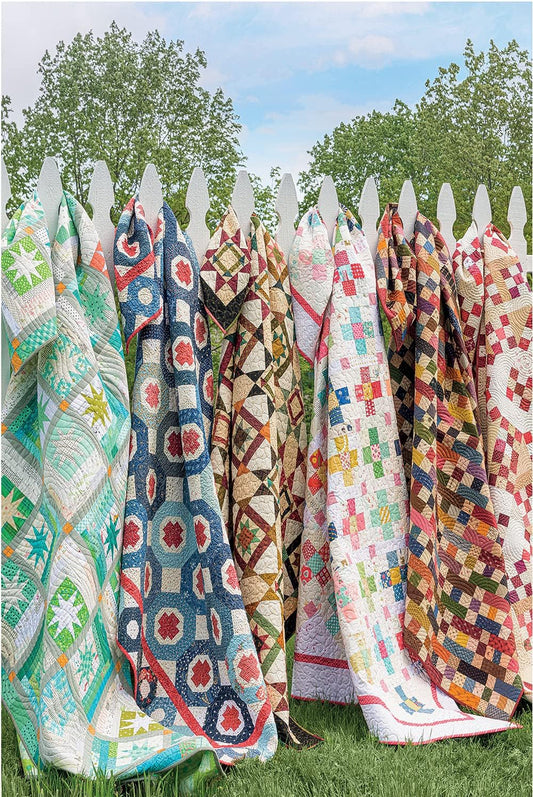 A collection of jigsaw puzzle pieces with various quilt patterns, assembled together to form a larger image.
Photo by Martingale [image_link]