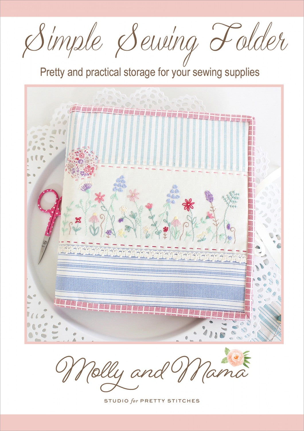 A Simple Sewing Folder with a floral embroidery pattern on the cover, labeled 'Molly and Mama' with a website address, used to store sewing supplies.
Photo by Molly and Mama [image_link]