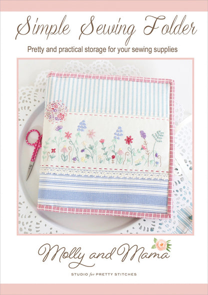 A Simple Sewing Folder with a floral embroidery pattern on the cover, labeled 'Molly and Mama' with a website address, used to store sewing supplies.
Photo by Molly and Mama [image_link]