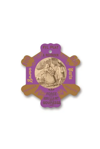 A vintage French patisserie thread card for 'Fil Plat A Repriser' and 'Force Brillant Souplesse' in purple and gold, displayed on a white background.
Photo by Sajou.fr [additional_image_link]