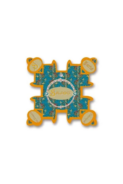 A decorative, irregularly shaped thread card featuring a central circular label reading 'Sajou' surrounded by small floral motifs and orange border details, placed on a white background.
Photo by Sajou.fr [image_link]