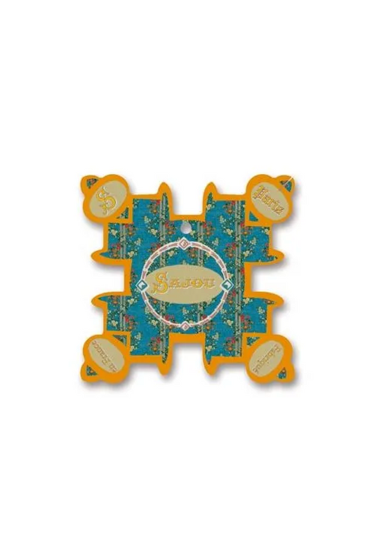 A decorative, irregularly shaped thread card featuring a central circular label reading 'Sajou' surrounded by small floral motifs and orange border details, placed on a white background.
Photo by Sajou.fr [image_link]