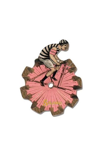A vintage-style illustrated thread card showing a cyclist riding a bicycle over a pink fan-like shape, placed on a white background.
Photo by Sajou.fr [additional_image_link]