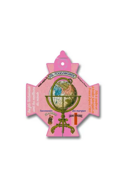 A pink cross-shaped thread card featuring a vintage globe on a stand, with French text and illustrations, displayed on a white background.
Photo by Sajou.fr [additional_image_link]