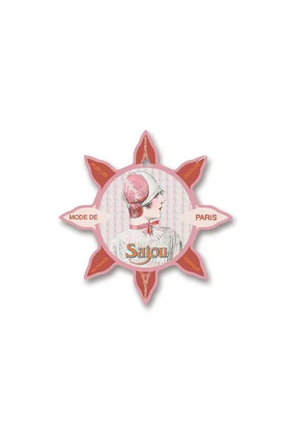 A vintage-style decorative thread card with a starburst shape, featuring a central illustration of a woman in a pink hat and the text 'Sajou' and 'MODE DE PARIS'. The tag is displayed flat against a white background.
Photo by Sajou.fr [additional_image_link]