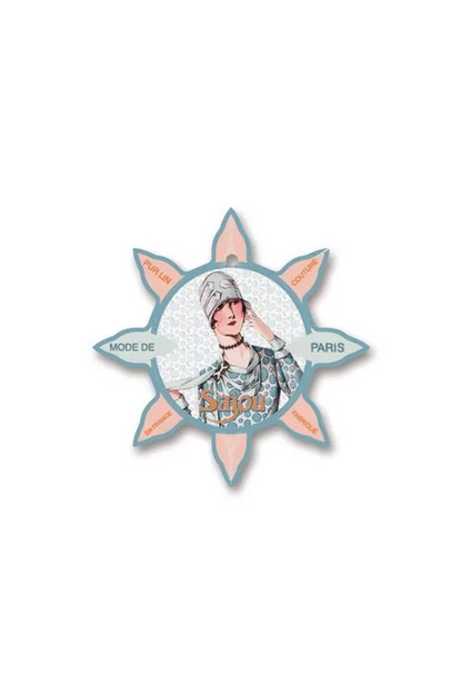 A decorative star-shaped thread card featuring a vintage illustration of a woman with a headscarf, with the words 'MODE DE PARIS' and 'Sajou' on a white background.
Photo by Sajou.fr [additional_image_link]