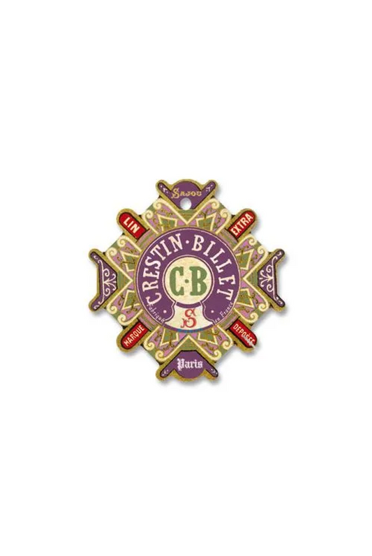 A vintage CRESTIN-BILLETS Paris decorative paper thread card with ornate purple, gold, and red details, placed on a white background.
Photo by Sajou.fr [image_link]