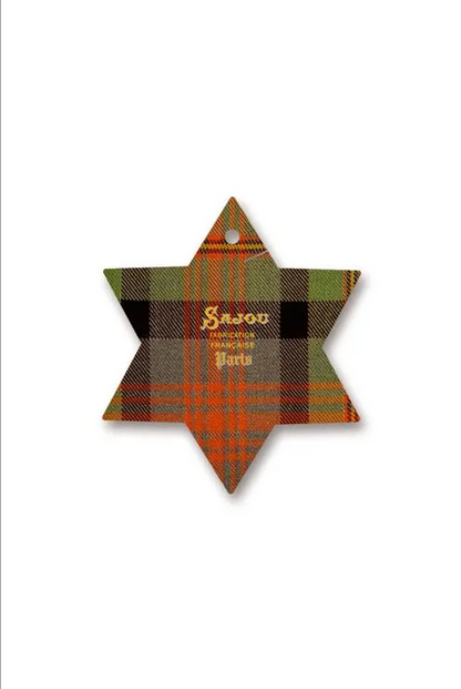 A six-pointed star thread card featuring a green, brown, and orange tartan plaid pattern, with the brand name 'Sajou' printed in gold in the center.
Photo by Sajou.fr [image_link]