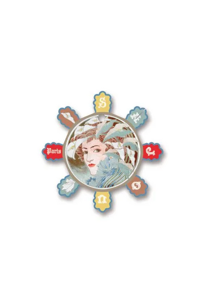 A vintage-style circular thread card with a central portrait of a woman surrounded by eight petal-like segments with letters and colors, displayed on a white background.
Photo by Sajou.fr [additional_image_link]