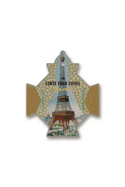 A decorative cross-shaped thread cards featuring an illustration of the Eiffel Tower with the text 'CARTE TOUR EIFFEL' and a gold patterned background, shown on a plain white background.
Photo by Sajou.fr [additional_image_link]