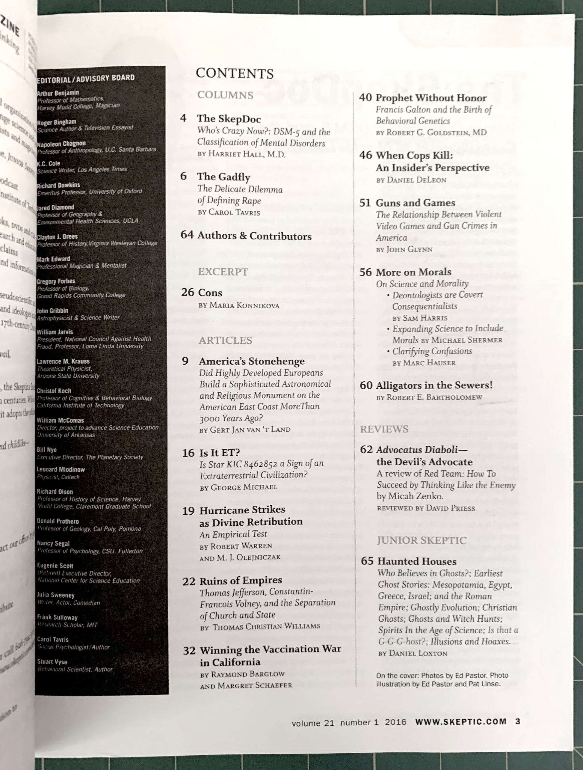 An open book showing the contents page of 'The Skeptical Review', volume 21, number 1, 2015. The left page features a black sidebar with article titles, authors, and publication details, while the right page lists article numbers and titles in white text on a light gray background.
[additional_image_link]