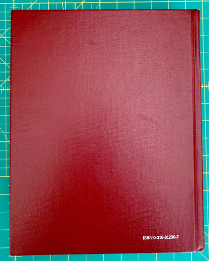 A hardcover book with a textured dark red cover, placed on a green cutting mat with grid lines. The ISBN number 'ISBN 0-315-81230-7' is printed in white at the bottom right corner.
[additional_image_link]