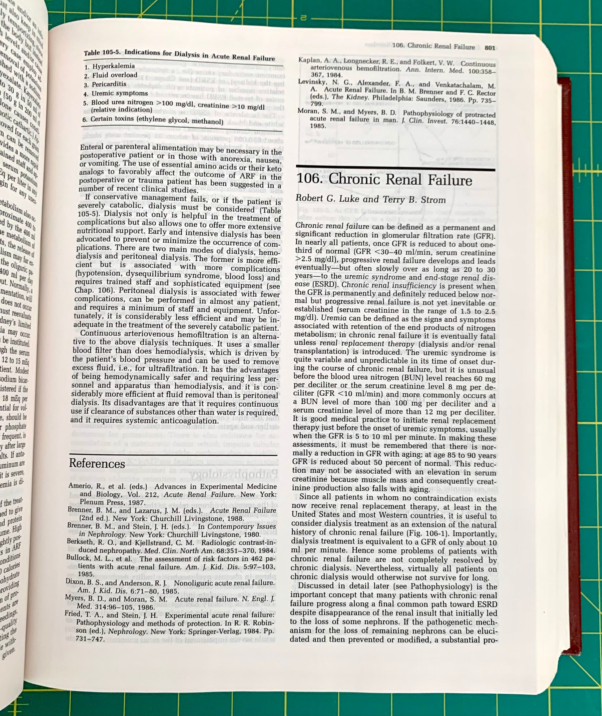 An open medical textbook page showing printed text about chronic renal failure, photographed from above on a green cutting mat.
[additional_image_link]