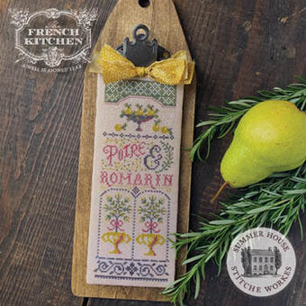Cross-stitched label for 'Poire & Romarin' on a wooden paddle with a pear and rosemary sprig.
Photo by HandsOnDesign.biz [additional_image_link]