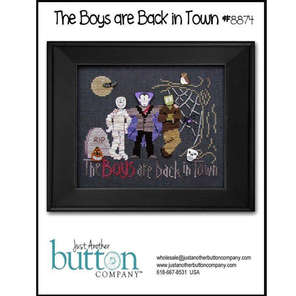 Framed cross-stitched artwork featuring characters with text 'The Boys are Back in Town' by Just Another Button Company.
Photo by JustAnotherButtonCompany.com [image_link]