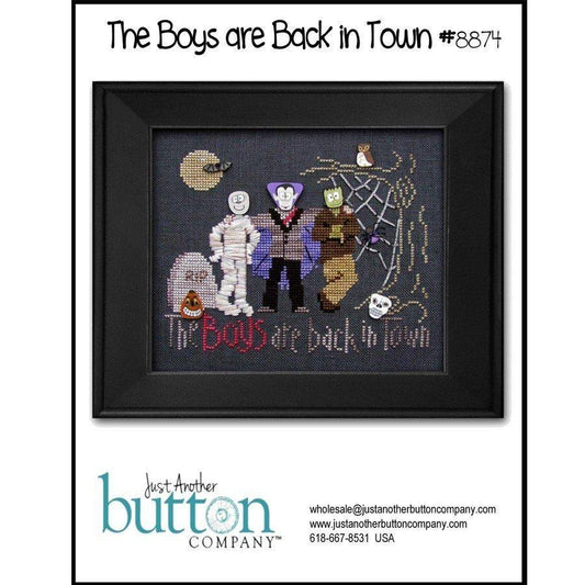 Framed cross-stitched artwork featuring characters with text 'The Boys are Back in Town' by Just Another Button Company.
Photo by JustAnotherButtonCompany.com [image_link]