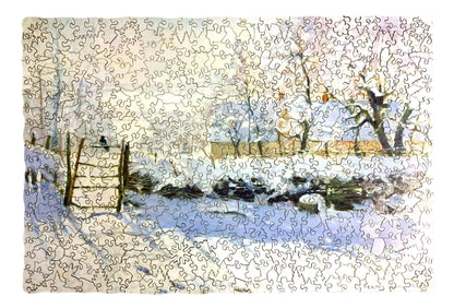 A jigsaw puzzle depicting a winter scene with a path, fence, and trees, predominantly in shades of white and blue by Claude Monet.
Photo by Karen King [additional_image_link]