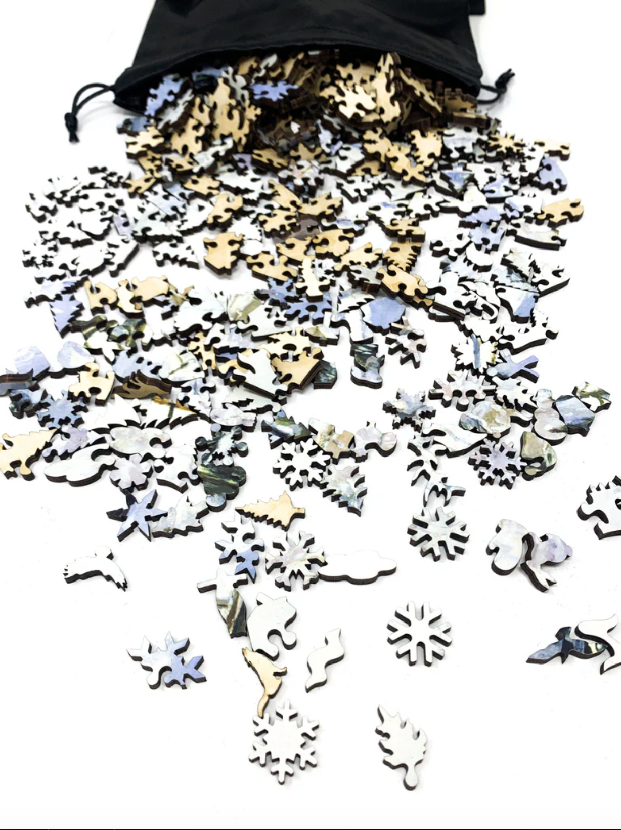 A jigsaw puzzle depicting a winter scene with a path, fence, and trees, predominantly in shades of white and blue by Claude Monet.
Photo by Nautilus Puzzles [additional_image_link]