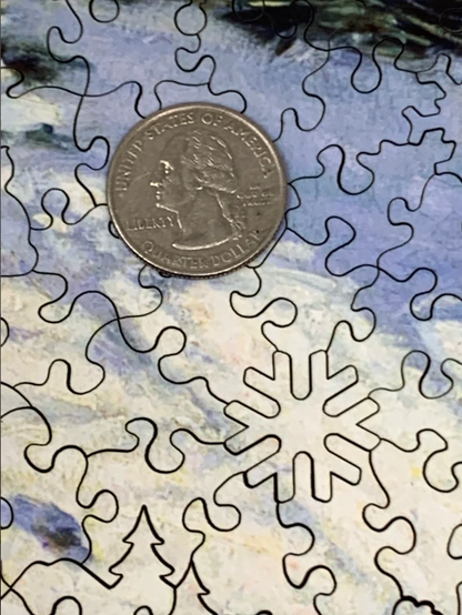 A jigsaw puzzle depicting a winter scene with a path, fence, and trees, predominantly in shades of white and blue by Claude Monet.
Photo by Nautilus Puzzles [additional_image_link]