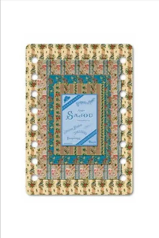 A square decorative thread organizer with a vintage floral and striped pattern in beige, blue, and green, featuring a central blue insert card labeled 'Sajou'.
Photo by Sajou.fr [image_link]