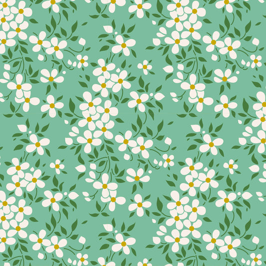 Pattern of white flowers with green leaves on a teal background.
Photo by Tildafabrics.com [image_link]