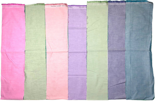 Rectangular fabric swatches in pastel colors arranged in a grid on a green cutting mat.
Photo by Karen King [image_link]