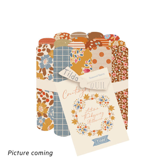 Collection of fabric swatches with various patterns and a Tilda label on a white background.
Photo by Tildafabrics.com [image_link]