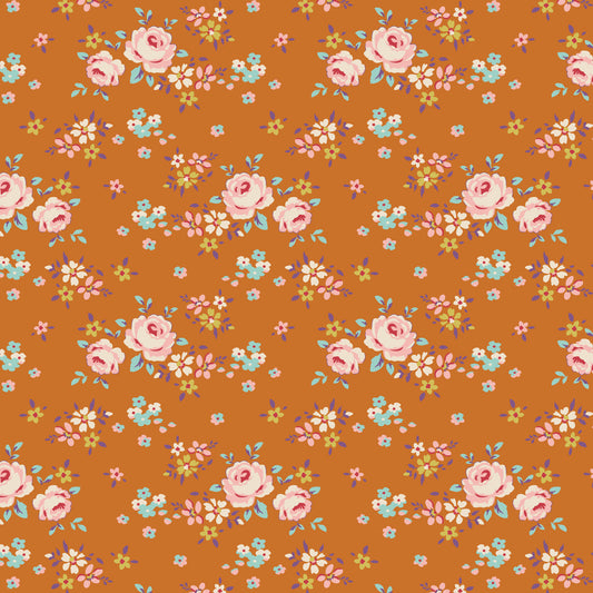 A fabric from the Tilda Creating Memories Gracie Ginger collection featuring a floral pattern with ginger, saffron, brown, and rust colors, and a hint of blue-grey, khaki, and toffee.
Photo by Tildafabrics.com [image_link]