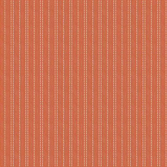 A seamstripe patterned fabric in an autumn color theme, predominantly ginger and brown tones, with a textured appearance.
Photo by Tildafabrics.com [image_link]
