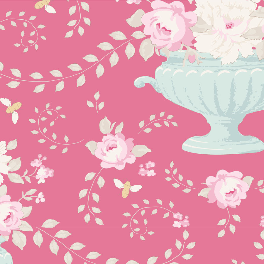 A repeating floral pattern on a pink background, featuring pale pink and white roses, cream vines and leaves, a light blue urn, and small yellow butterflies.
Photo by Tildafabrics.com [image_link]