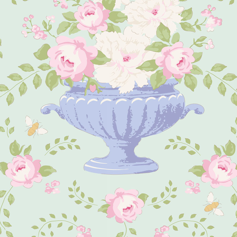 Decorative pattern with flowers and a blue urn on a light green background.
Photo by Tildafabrics.com [image_link]