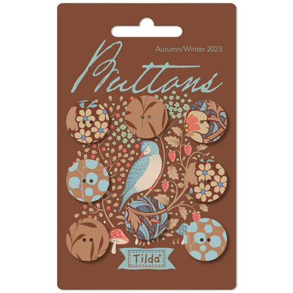 Pack of Tilda brand fabric covered buttons featuring floral and nature motifs, suitable for autumn/winter 2023 collection, in a brown color palette.
Photo by Tildafabrics.com [image_link]