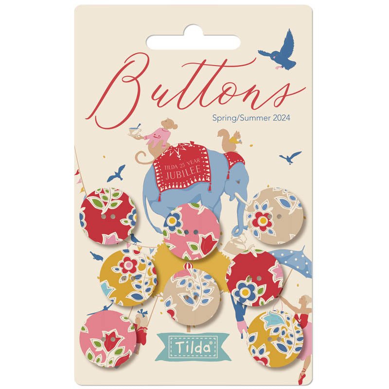 Packaging of Tilda Jubilee Fabric Covered Buttons with a variety of floral patterned buttons displayed in front of a card with the Tilda brand logo and a illustration of an elephant.
Photo by Tildafabrics.com [image_link]