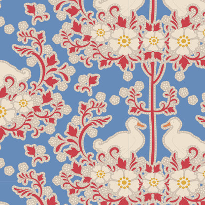 A yardage sample of Tilda Jubilee Duck Nest Blue fabric featuring a blue background with a red and white floral pattern.
Photo by Tildafabrics.com [additional_image_link]