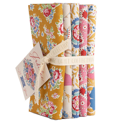 Set of floral fabric swatches with a decorative tag on a white background.
Photo by Tildafabrics.com [additional_image_link]