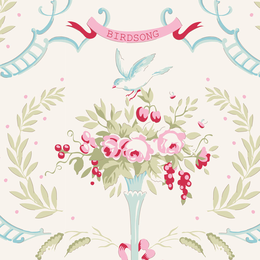 A repeating decorative floral pattern with a central bouquet of pink flowers and red berries in a pale blue vase, a blue bird above, and the word BIRDSONG on a pink ribbon banner.
Photo by Tildafabrics.com [image_link]